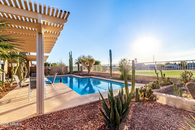 view of pool featuring a fenced in pool, a patio area, a fenced backyard, and a pergola