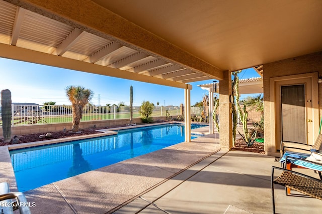 view of pool featuring a patio area, a fenced backyard, and a fenced in pool