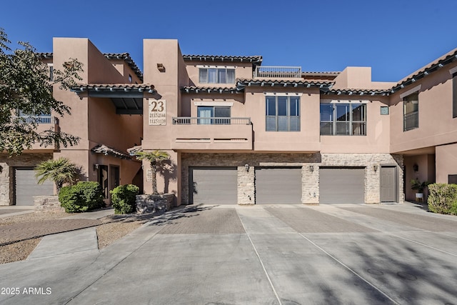 view of front of property with solar panels and a garage