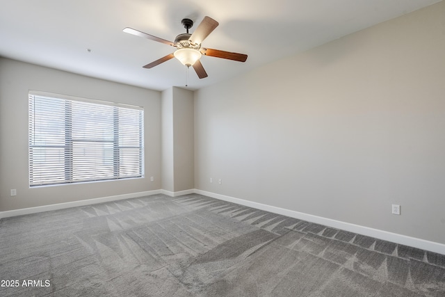 carpeted empty room featuring ceiling fan