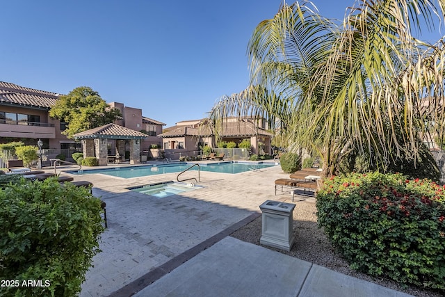 view of swimming pool with a gazebo, a hot tub, and a patio area