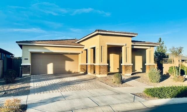 prairie-style home featuring a garage