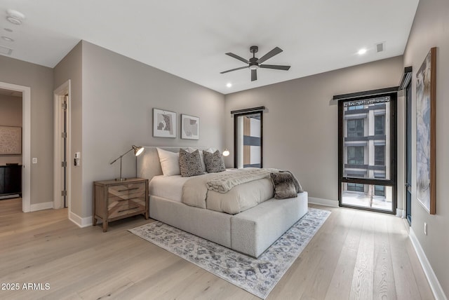 bedroom with light wood finished floors, visible vents, baseboards, recessed lighting, and a ceiling fan