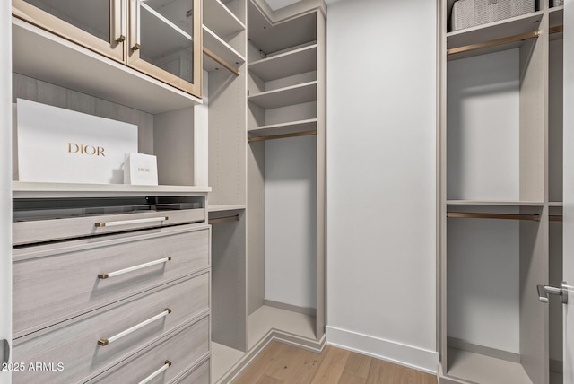 walk in closet featuring light wood-style floors