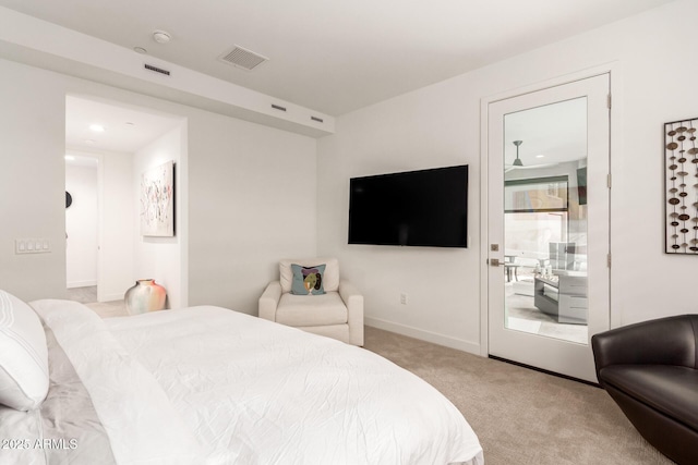 carpeted bedroom featuring connected bathroom