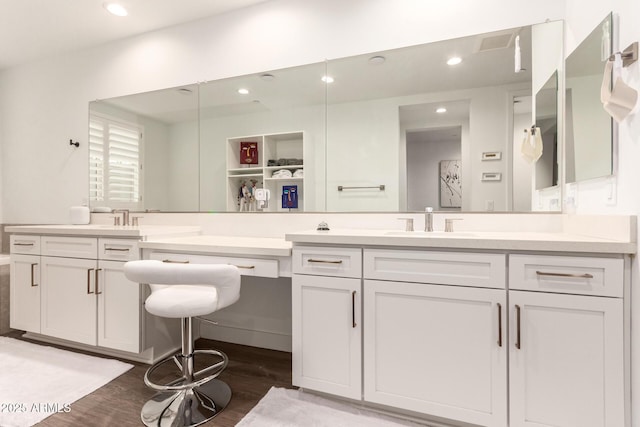 bathroom with vanity and hardwood / wood-style flooring