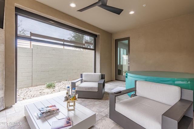 view of patio with an outdoor hangout area, a hot tub, and ceiling fan