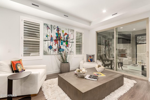 living area featuring hardwood / wood-style floors