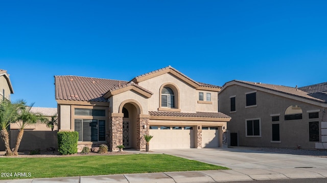 mediterranean / spanish-style house with a garage