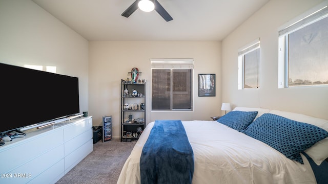 bedroom with ceiling fan and light colored carpet