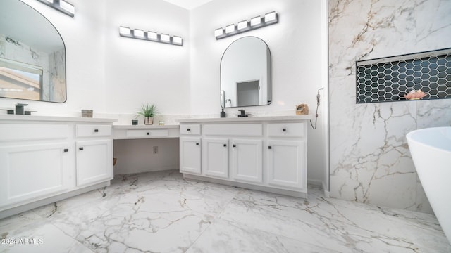 bathroom featuring vanity and a bath