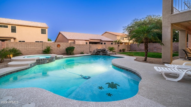 view of pool with an in ground hot tub