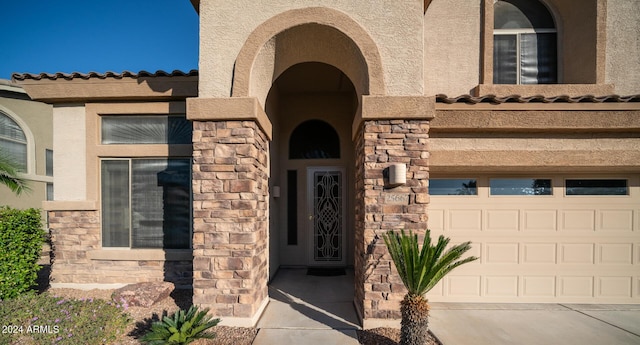 property entrance with a garage