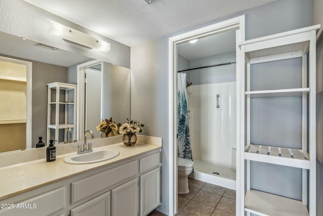 full bath with visible vents, curtained shower, toilet, tile patterned floors, and vanity