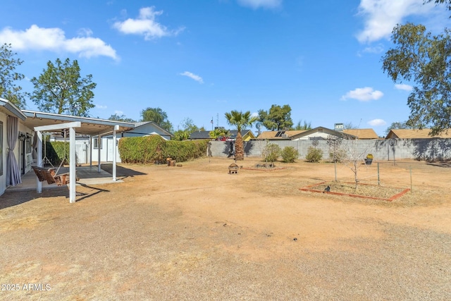 view of yard featuring a patio area and a fenced backyard