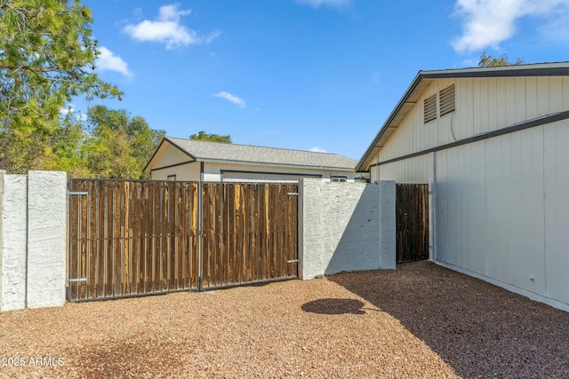 exterior space with an outdoor structure and fence