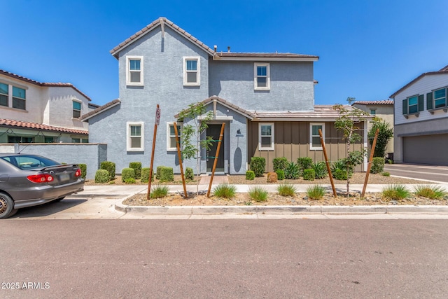 4833 S Ferric, Mesa, AZ 85212 - traditional home featuring board and batten siding, a tile roof, and stucco siding