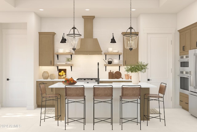 kitchen featuring a kitchen bar, hanging light fixtures, and custom exhaust hood