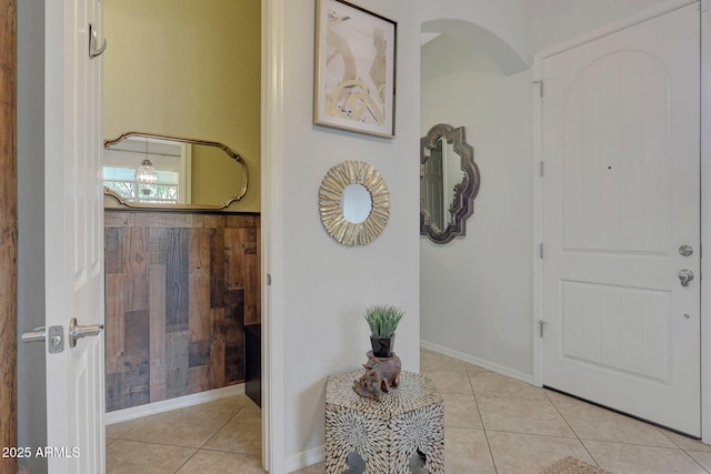 tiled entryway featuring arched walkways