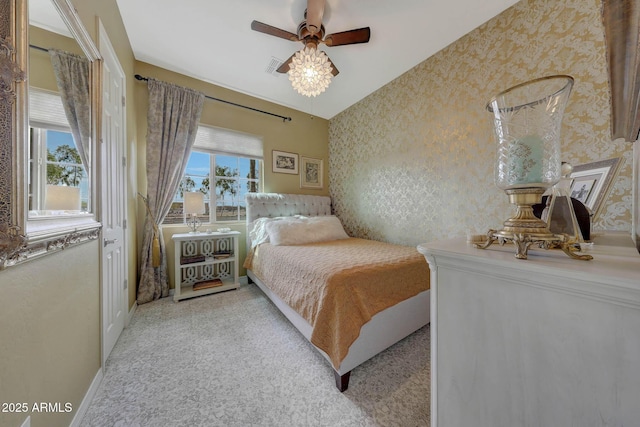 bedroom featuring baseboards, carpet floors, visible vents, and wallpapered walls