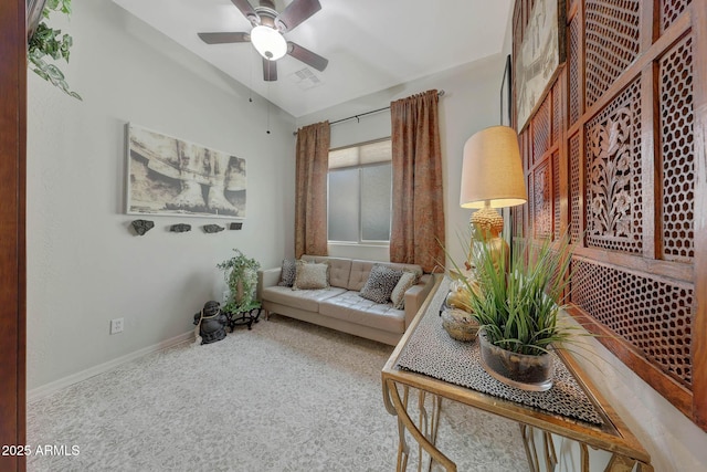 sitting room with a ceiling fan, carpet flooring, visible vents, and baseboards