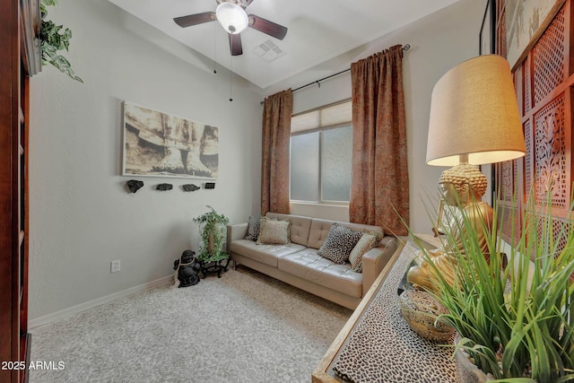 sitting room featuring a ceiling fan, visible vents, baseboards, and carpet flooring