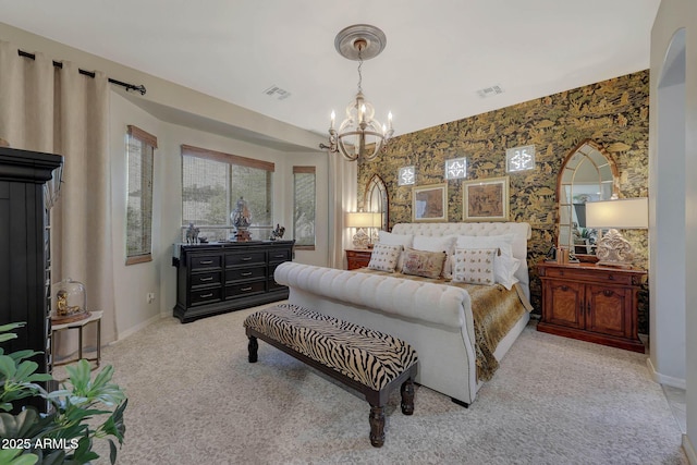 bedroom featuring wallpapered walls, baseboards, visible vents, and a chandelier