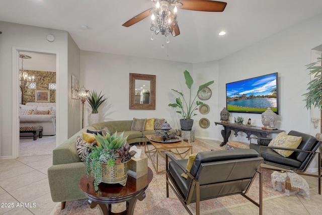 tiled living area featuring ceiling fan and baseboards