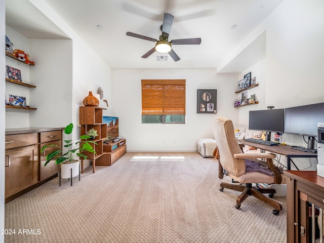 office space featuring light colored carpet and ceiling fan