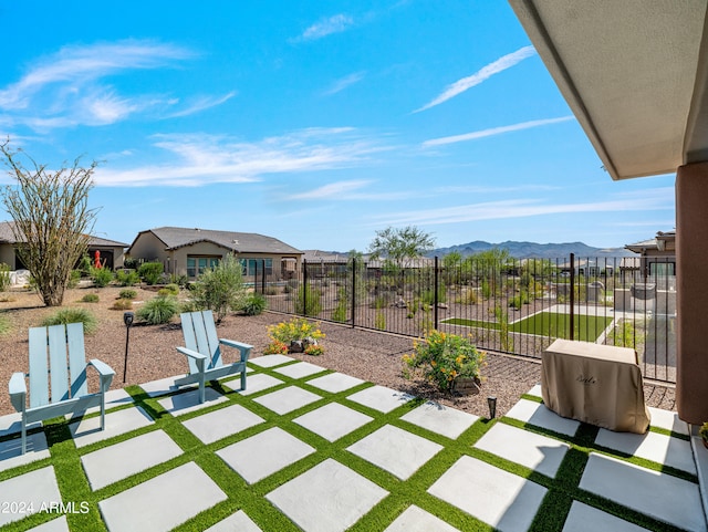 view of patio / terrace with a mountain view