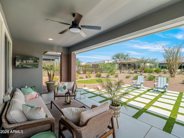 view of patio / terrace with ceiling fan and an outdoor living space