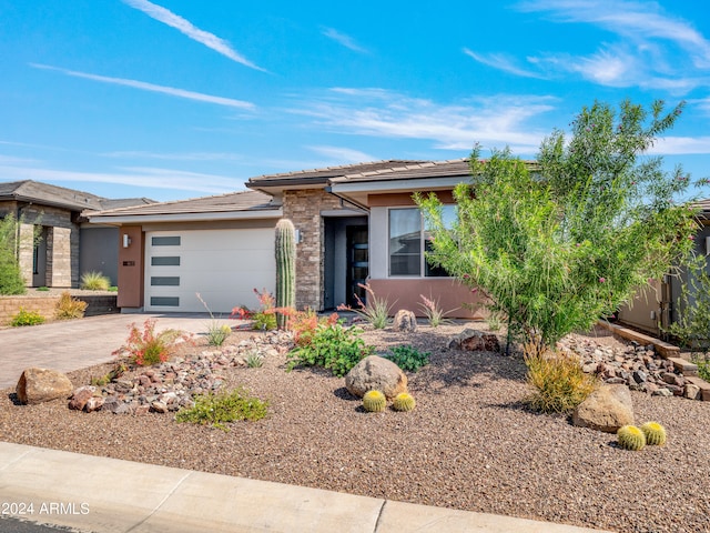 prairie-style home featuring a garage