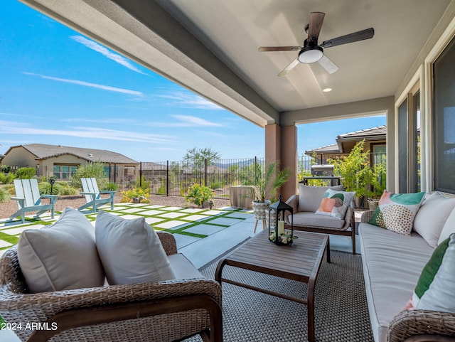 view of patio with outdoor lounge area and ceiling fan