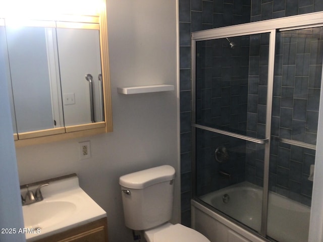 full bathroom with vanity, toilet, and combined bath / shower with glass door