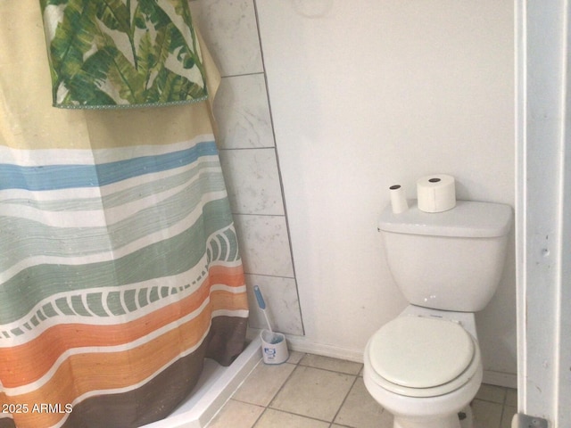 bathroom with tile patterned floors, toilet, and a shower with shower curtain