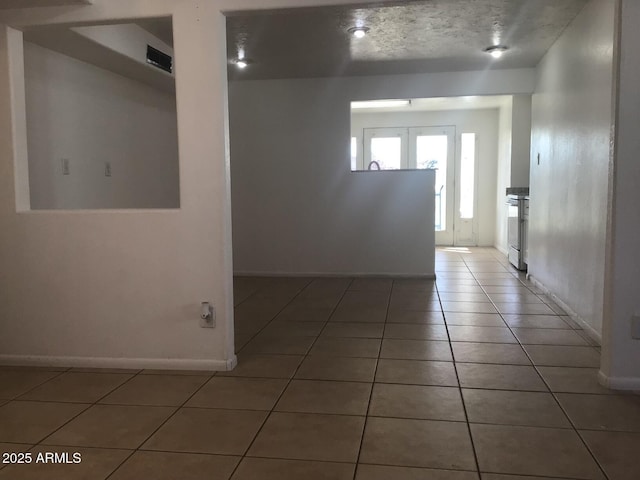 spare room with tile patterned flooring