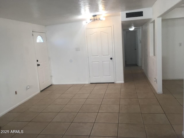 entryway with tile patterned floors