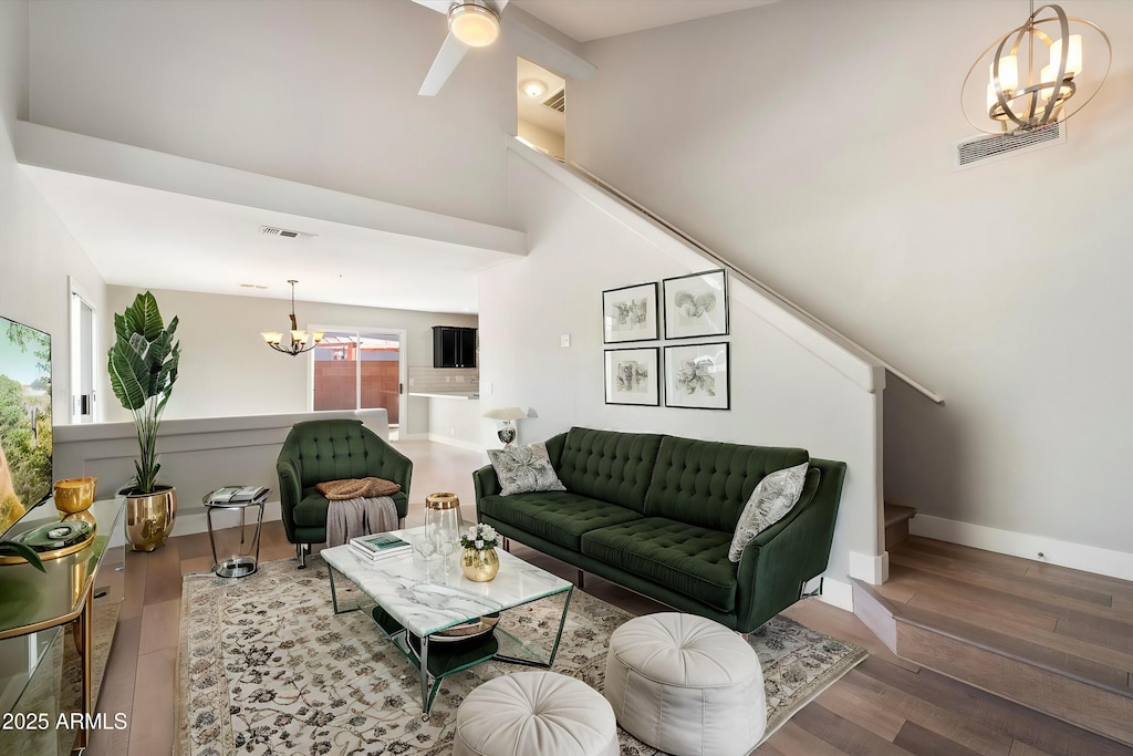 living room featuring hardwood / wood-style flooring and a notable chandelier