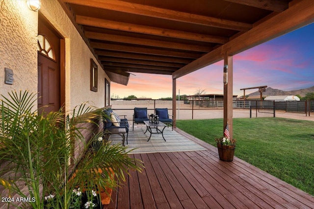 deck at dusk with a lawn