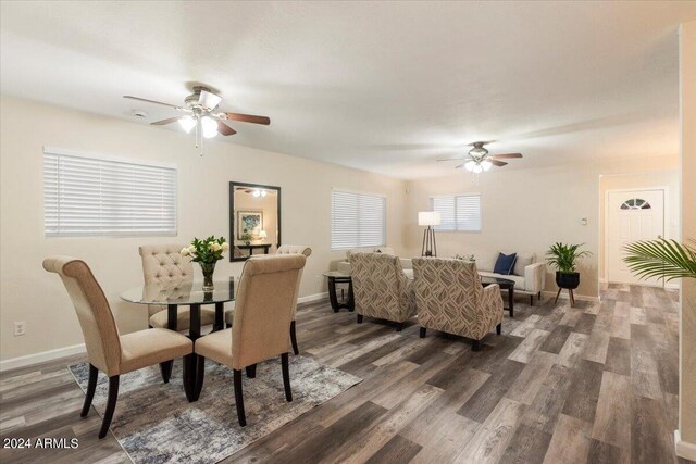 dining area with ceiling fan and hardwood / wood-style flooring