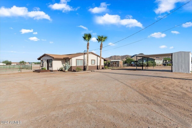 view of front of property with a carport