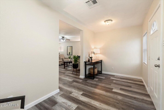 entryway with dark wood-type flooring and ceiling fan