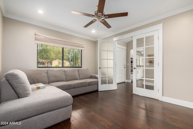 living room featuring french doors, ornamental molding, dark wood-type flooring, and ceiling fan