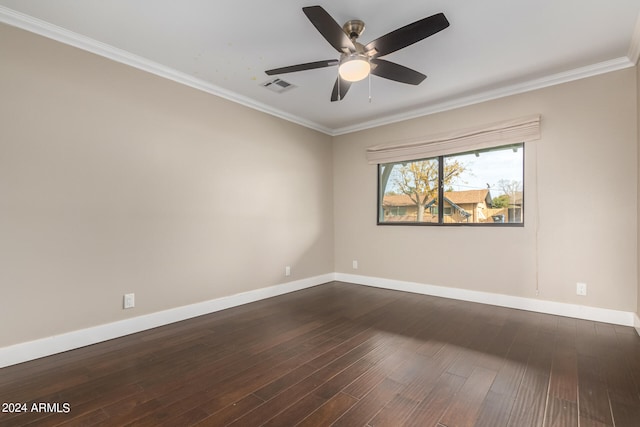 empty room featuring ornamental molding, ceiling fan, and dark hardwood / wood-style floors