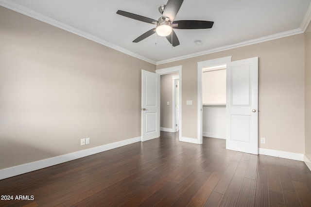 unfurnished bedroom featuring ornamental molding, ceiling fan, a closet, and dark hardwood / wood-style flooring