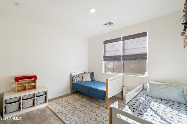 bedroom with light colored carpet