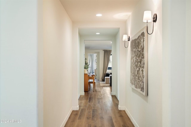 corridor with wood-type flooring