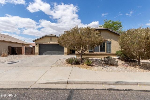 25212 W Maldonado Dr, Buckeye, AZ 85326 - obstructed view of property with fence, a tile roof, a garage, stucco siding, and driveway
