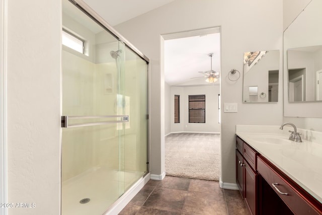 25212 W Maldonado Dr, Buckeye, AZ 85326 - bathroom with vanity, baseboards, a ceiling fan, and a stall shower