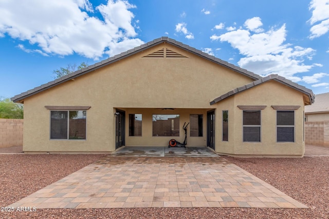 25212 W Maldonado Dr, Buckeye, AZ 85326 - rear view of property with fence, a ceiling fan, a patio, and stucco siding